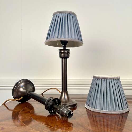 A Pair of Patinated Brass Candle Lamps