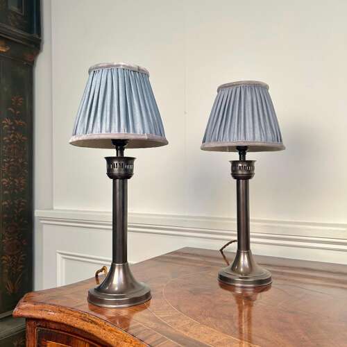 A Pair of Patinated Brass Candle Lamps