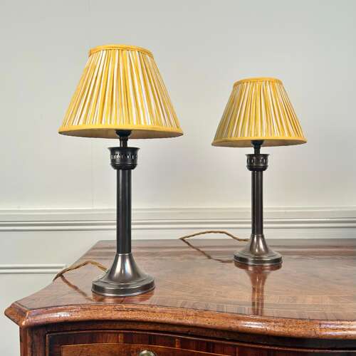 A Pair of Patinated Brass Candle Lamps