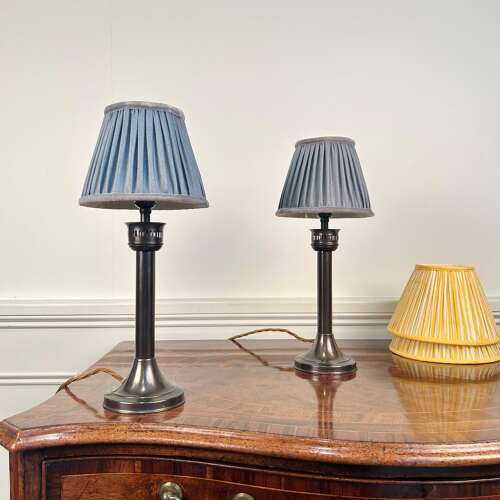 A Pair of Patinated Brass Candle Lamps